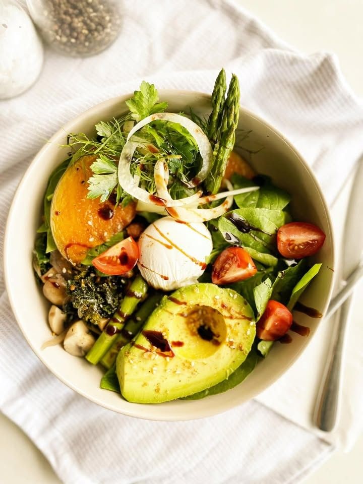 A grain bowl with haloumi, avocado, beetroot and dukkah