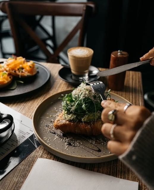 Smashed avo on toast with a coffee at Lucas Town Cafe