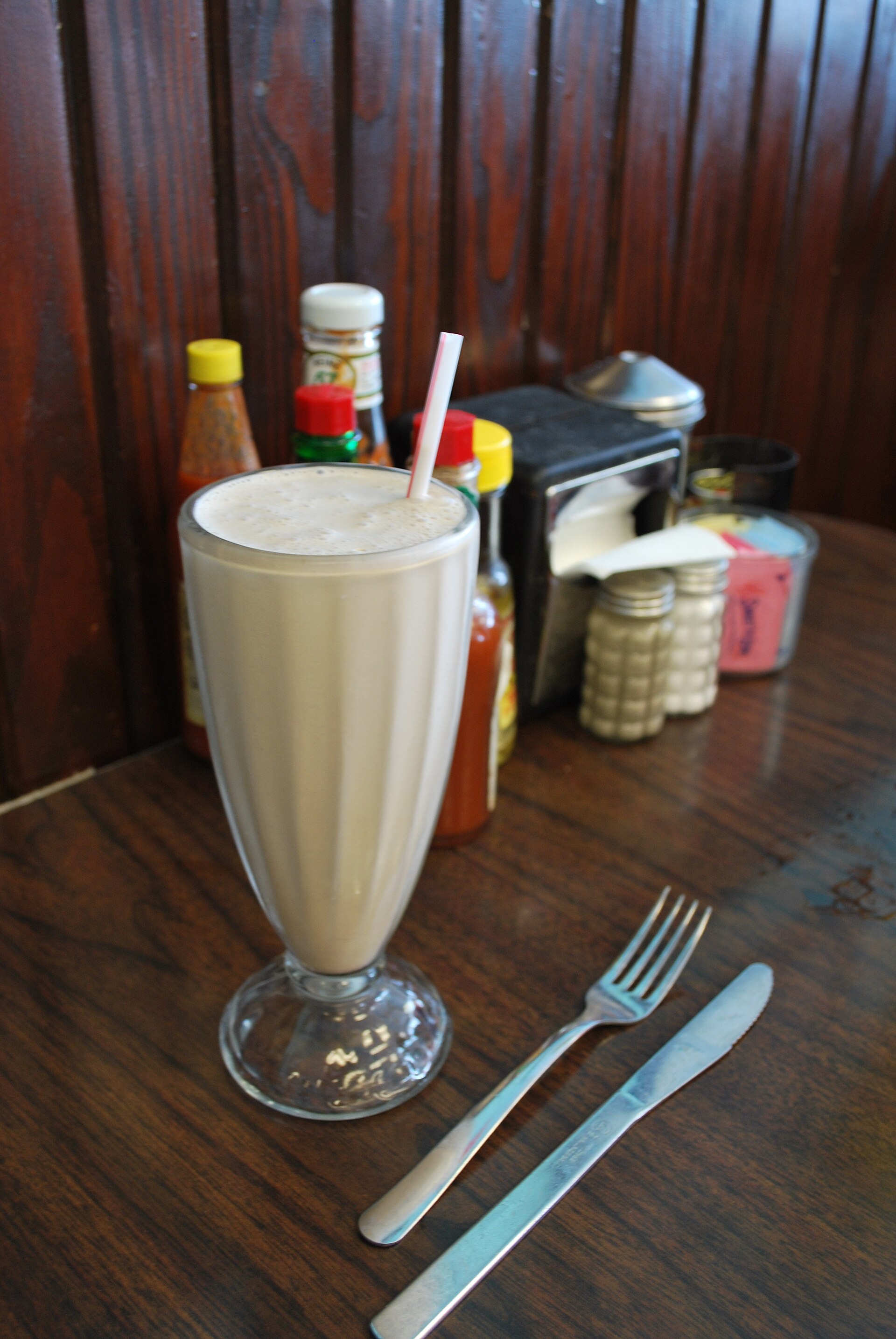 A milkshake in a tall glass